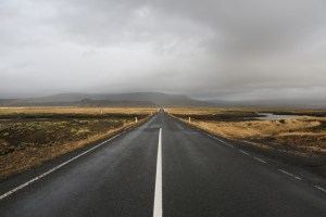 a tarmac road dissapearing into the distance